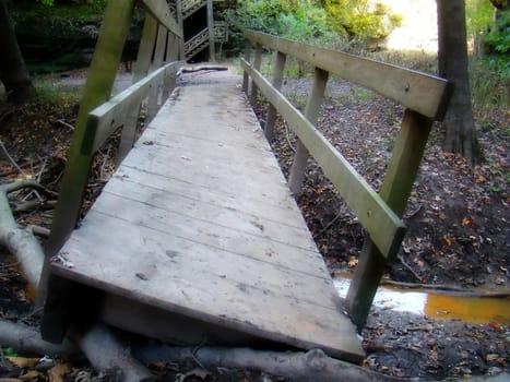 crooked, broken bridge in matthiessen state park