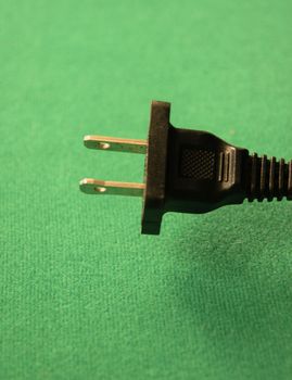 The plug end of an electrical cord