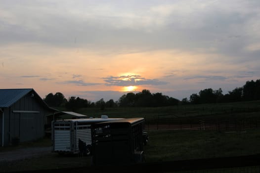 A horse farm in the evening as it closes down for the day