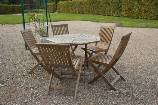 Restaurant table and chairs in a back yard patio