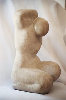 A sculpture of a man done in stome