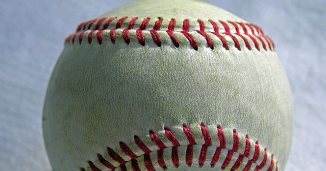 baseball up close against a blue background