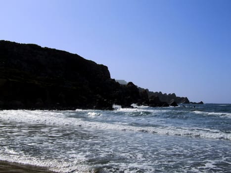 Typical rocky coastline in Malta, punctuated with sheer drops and jagged cliffs