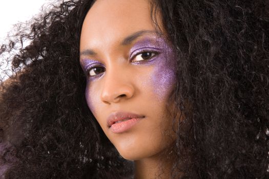 Beautiful girl with purple eyeshadow and wild hair