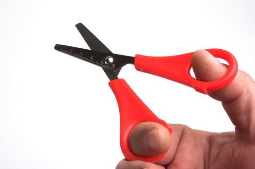  color scissors in hand over white