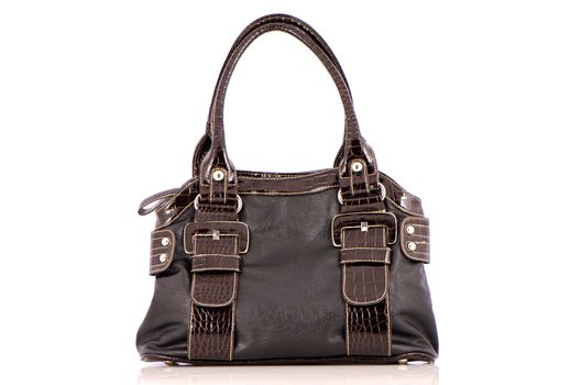 Brown woman bag on white reflective background.
