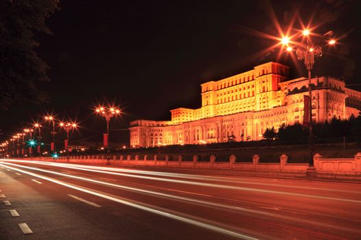 Cars light trails during the night in front of the Palace of the Parliament in Bucharest, Romania. 