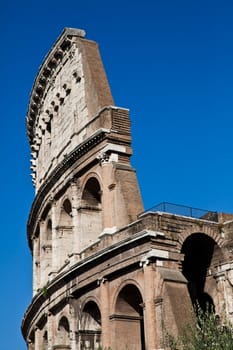 Colosseum in Rome with blue sky, landmark of the city