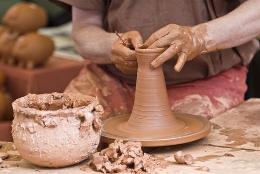 Potter working with clay.