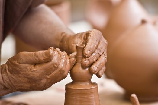 Potter working with clay.