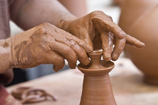 Potter working with clay.