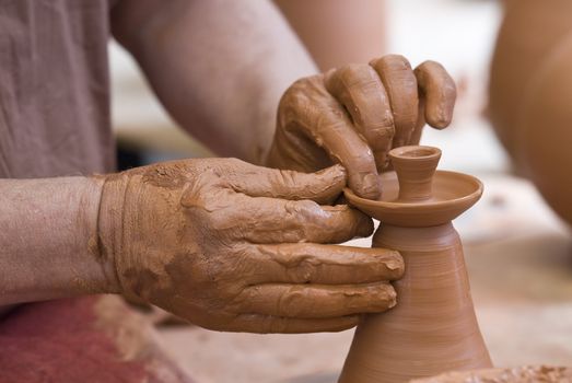 Potter working with clay.