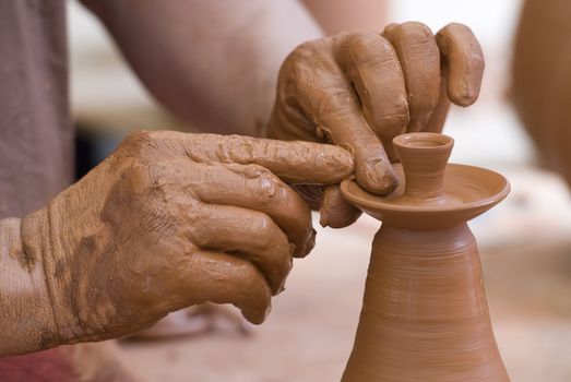 Potter working with clay.