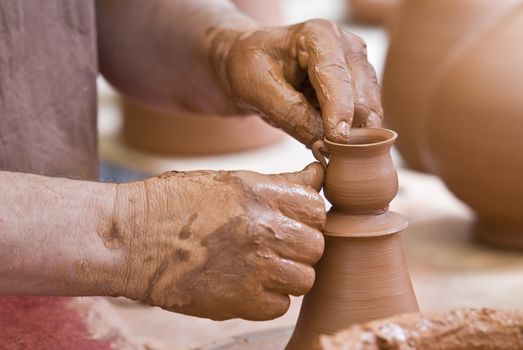 Potter working with clay.