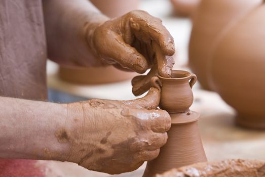 Potter working with clay.