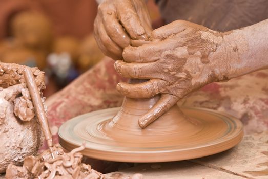 Potter working with clay.