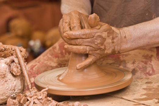 Potter working with clay.