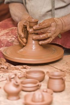 Potter working with clay.