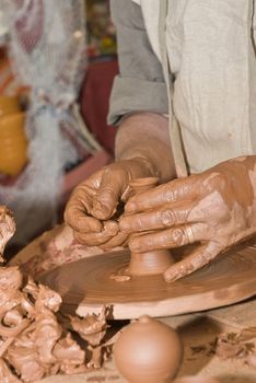 Potter working with clay.