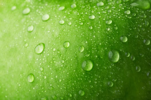 Water drop on green apple surface