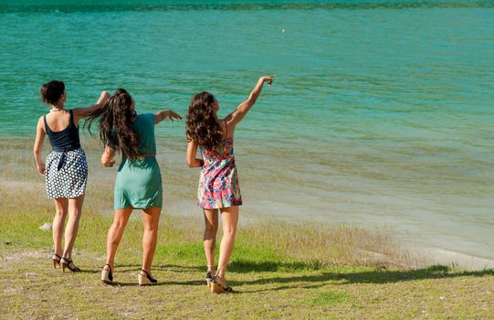 Throwing stones into a scenic mountain lake