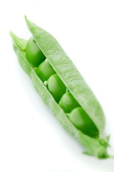 A pea pod revealing peas against white background