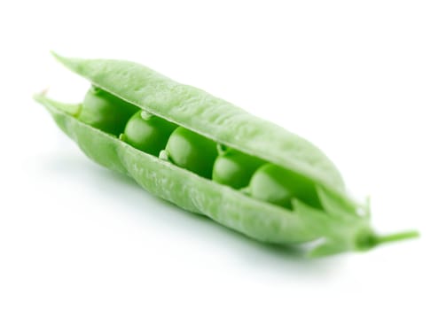 A pea pod revealing peas against white background