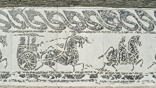 Chinese ancient rock art of vehicles and horses 