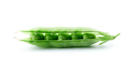 A pea pod revealing peas against white background