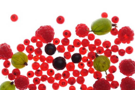 Spilled  mixed berries on white background