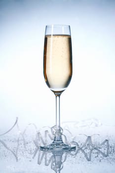 Glass of champagne with festive ribbons