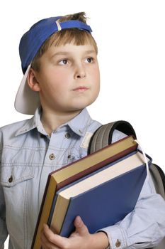 Schoolboy with backpack and books