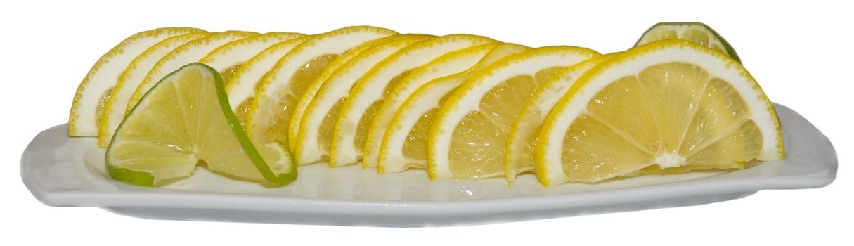 The cut lemons and limes are in the plate (isolated on white background)