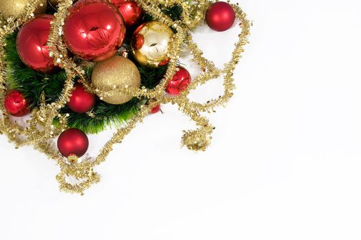 Elegant Christmas baubles with stars, angels and gold ribons on a slightly textured reflective surface