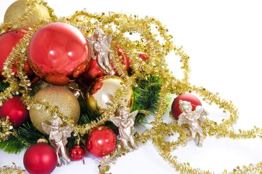 Elegant Christmas baubles with stars, angels and gold ribons on a slightly textured reflective surface