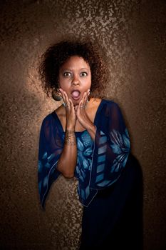 Pretty African American Woman Wearing Blue Dress Caught in Spotlight