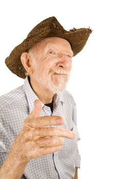 Handsome senior man wearing straw cowboy style hat