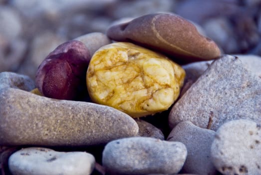 Colorful stones photographed up close. Different shapes and colors.