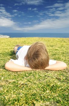 Lying in grass watching the clouds roll by..... to the lullaby of the ocean 
