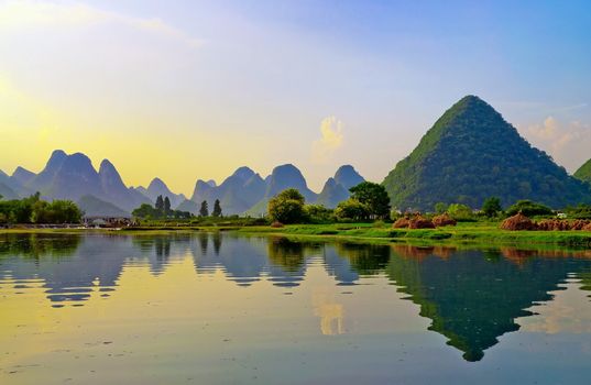 Reflection of the muntains in Li River landscape on sunset, Yangshuo near Guilin, China