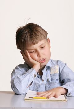 A child with homework or schoolwork


