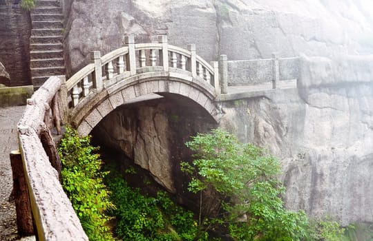 Foggy Stone bridge in Huangshan mountains, China