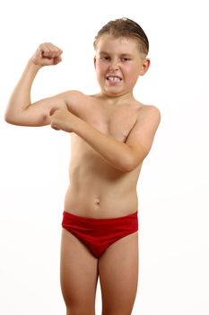 Boy points to muscles in his arm