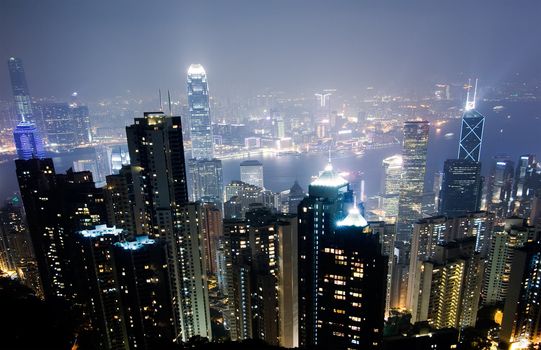 Skyline in City with famous skyscraper scene in night in Hong Kong, Asia.