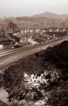 City scene in morning with road and street lamp.