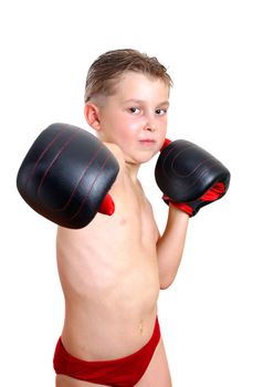 Boy boxer wearing gloves, throws a punch