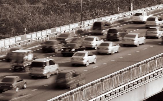 Traffic of cars driving fast on the highway.
