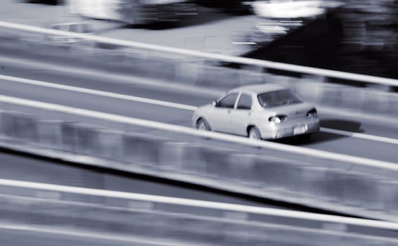 Single Car on road with motion blurred.