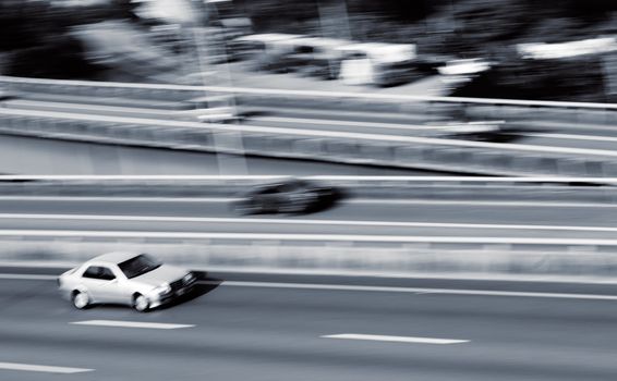 Cars on highway with fast motion blurred.