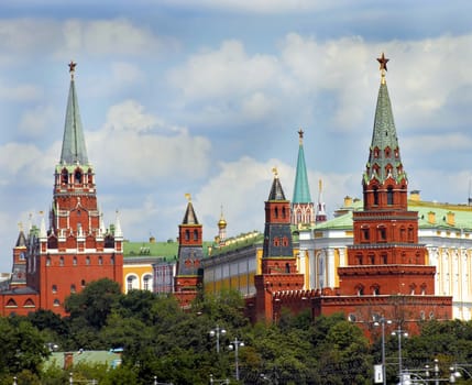 Moscow Kremlin towers cityscape over blue sky